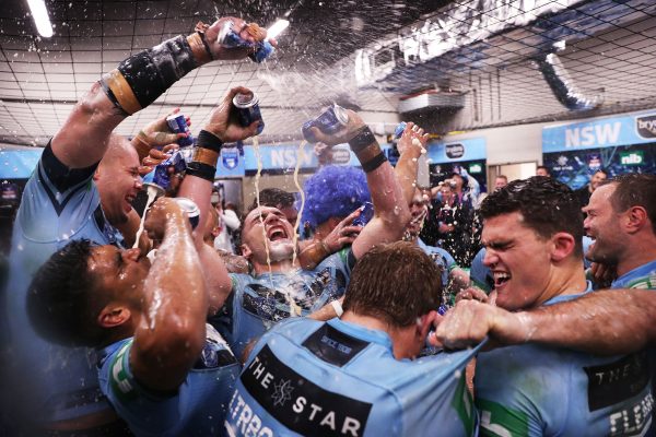 New South Wales Blues players celebrate after defeating Queensland in game two of the State of Origin series at ANZ Stadium, Sydney.
