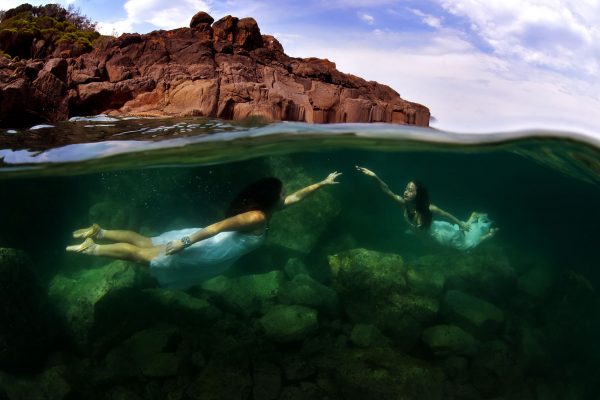 Brooke Macdonald and Olivia Mitchell have performed together for five years, and choreographed a dance to be performed by 24 students from Kiama High School at the 2018 South Coast Dance Festival. Photographed in the ocean, their every move was challenged by the pull of the current, cold water temperature and the weight of their dresses.