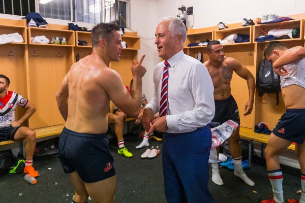 Cooper Cronk of the Sydney Roosters has some words with then-Prime Minister Malcolm Turnbull after the round five NRL match against the Cronulla-Sutherland Sharks at Southern Cross Group Stadium in Sydney.