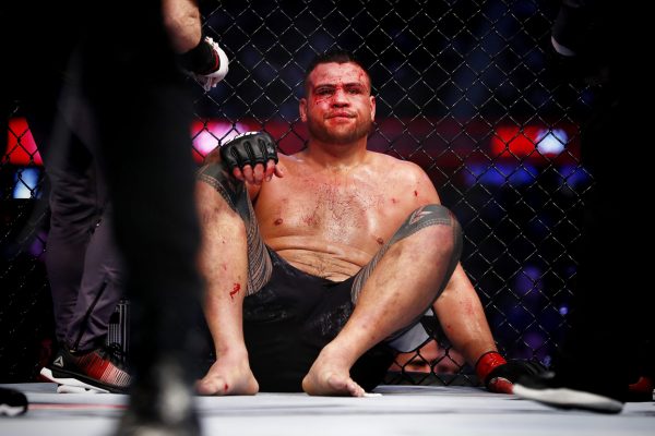 Australian fighter Tai Tuivasa recovers after being defeated in the second round.